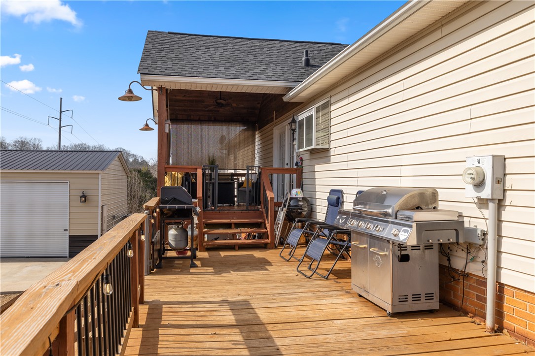 903 Huckleberry Lane Anderson, SC 29625 - Photo 31 of 42 This spacious deck offers ample outdoor entertaining space with an additional storage shed nearby.