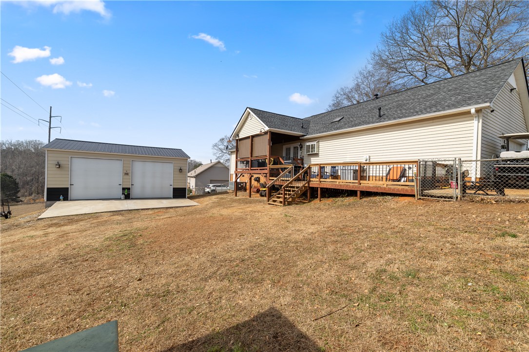 903 Huckleberry Lane Anderson, SC 29625 - Photo 32 of 42 This residence features a spacious yard, offering ample outdoor living space and a detached garage.