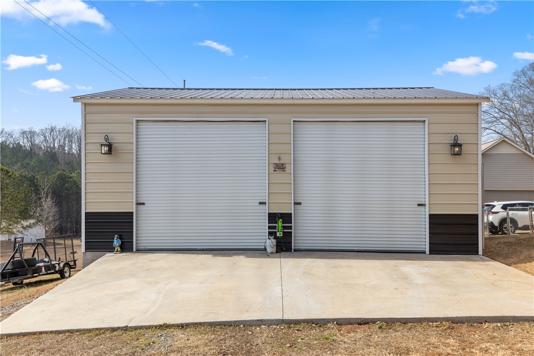 903 Huckleberry Lane Anderson, SC 29625 - Photo 33 of 42 This spacious garage offers ample storage with convenient roll-up doors.