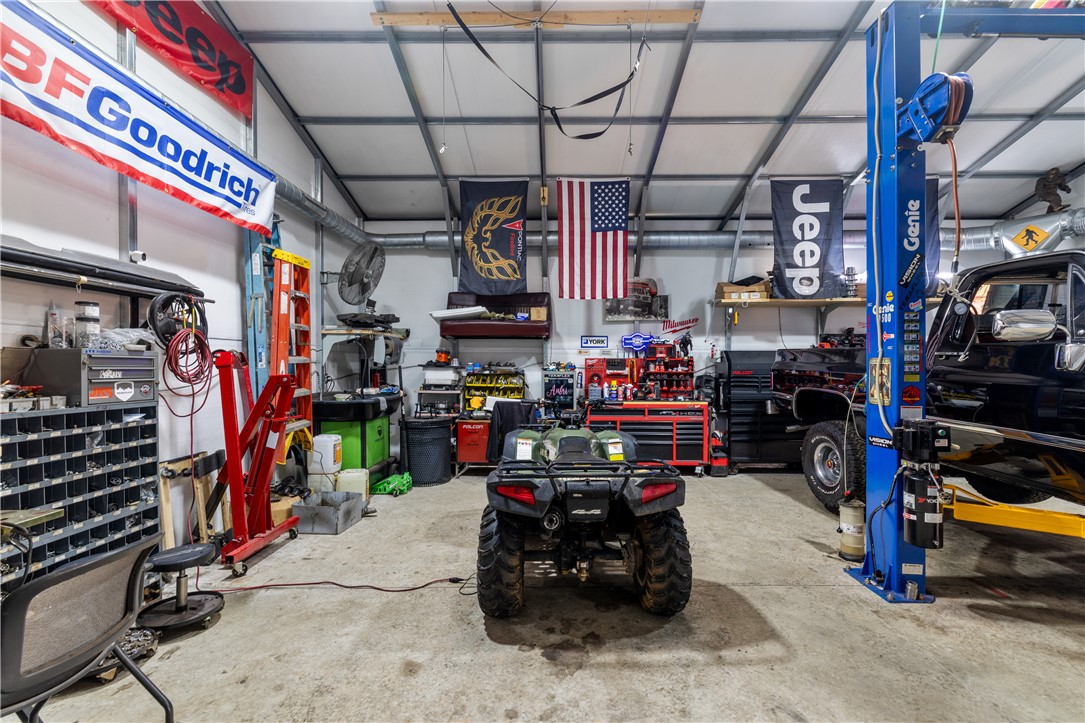 903 Huckleberry Lane Anderson, SC 29625 - Photo 35 of 42 This spacious garage offers ample room and concrete flooring, ideal for a workshop or storage.