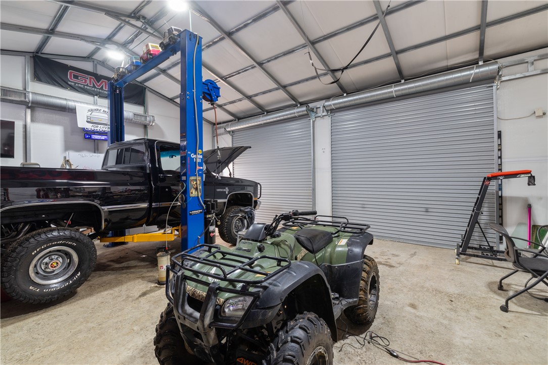 903 Huckleberry Lane Anderson, SC 29625 - Photo 36 of 42 This spacious garage offers ample room for vehicles and projects, featuring high ceilings and practical roll-up doors.