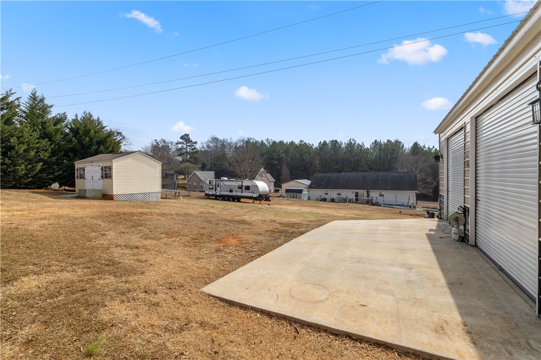 903 Huckleberry Lane Anderson, SC 29625 - Photo 37 of 42 This spacious yard offers ample outdoor living possibilities with versatile outbuildings.