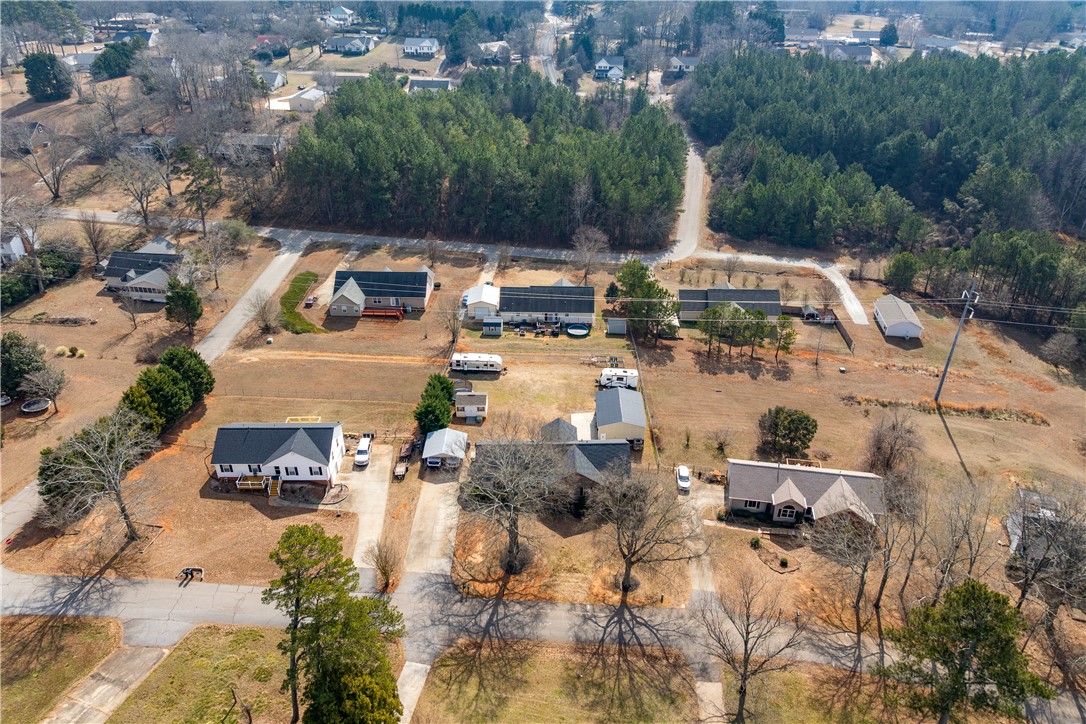 903 Huckleberry Lane Anderson, SC 29625 - Photo 40 of 42 This elevated view captures a serene residential area with charming homes nestled among lush greenery.