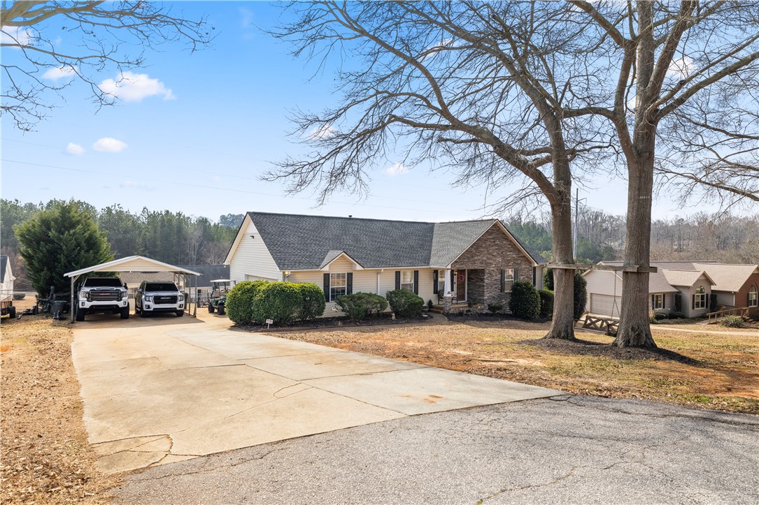 903 Huckleberry Lane Anderson, SC 29625 - Photo 4 of 42 This ranch-style residence features a durable shingle roof, charming siding, and an inviting covered porch.