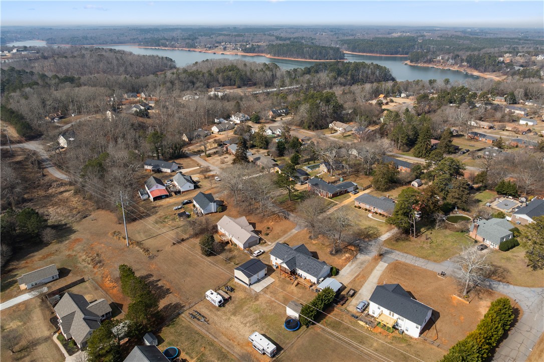 903 Huckleberry Lane Anderson, SC 29625 - Photo 41 of 42 An aerial perspective reveals a residential community with verdant surroundings and distant water views.