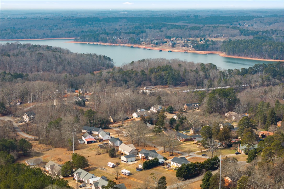 903 Huckleberry Lane Anderson, SC 29625 - Photo 42 of 42 Observe this serene lakeside community nestled among mature trees.