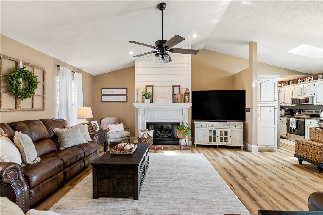 903 Huckleberry Lane Anderson, SC 29625 - Photo 7 of 42 This inviting living space features vaulted ceilings and a cozy fireplace, perfect for gatherings.