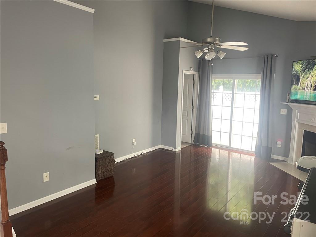915 Copperstone Lane, Unit 189 Fort Mill, SC 29708 - Photo 4 of 15 an empty room with wooden floor and windows