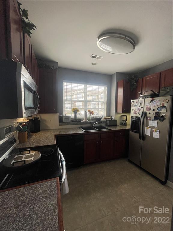 915 Copperstone Lane, Unit 189 Fort Mill, SC 29708 - Photo 10 of 15 a kitchen with a sink appliances and cabinets