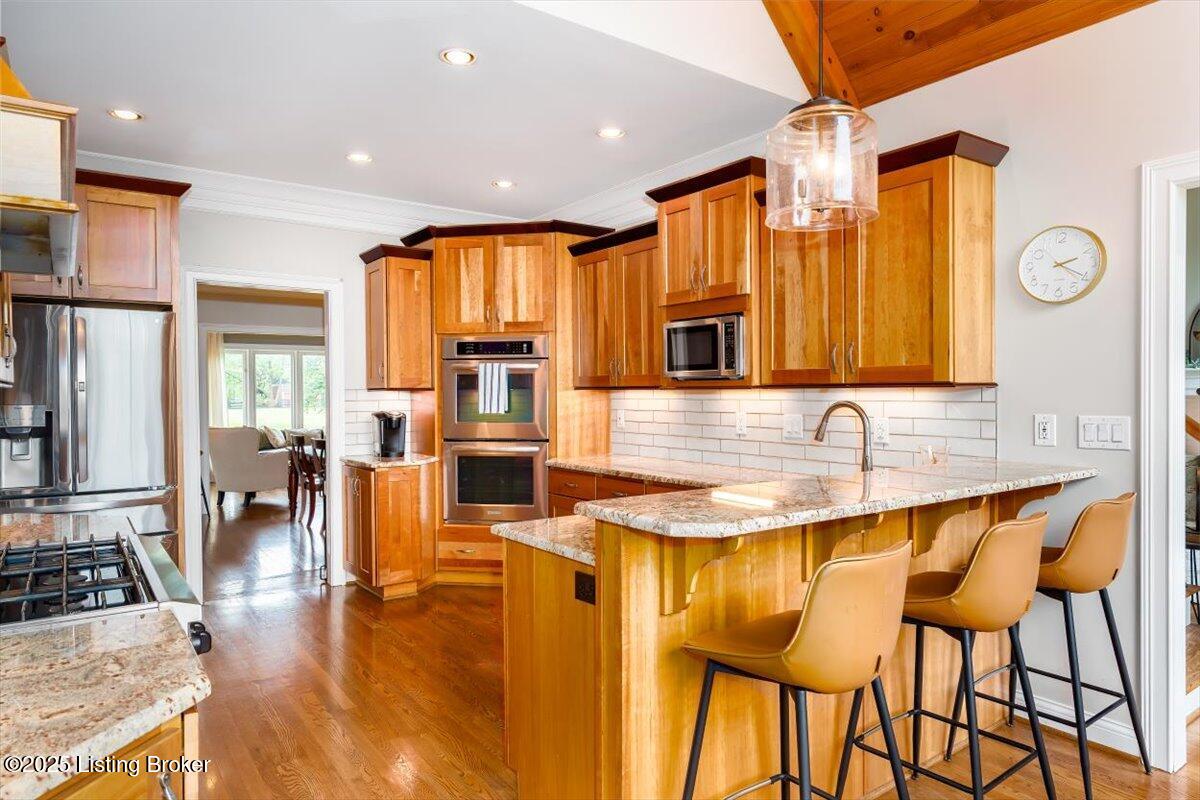 10801 Little Pond Road Goshen, KY 40026 - Photo 30 of 73 Natural wood tones magnify the beauty of this homes kitchen and breakfast area, complimented by abundant natural light and beautiful green views