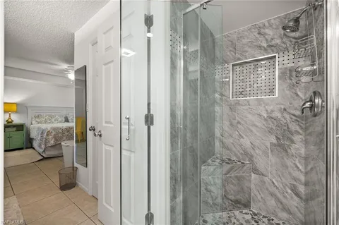 a bathroom with a shower and a sink