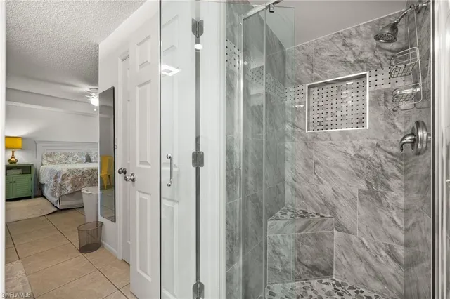 a bathroom with a shower and a sink