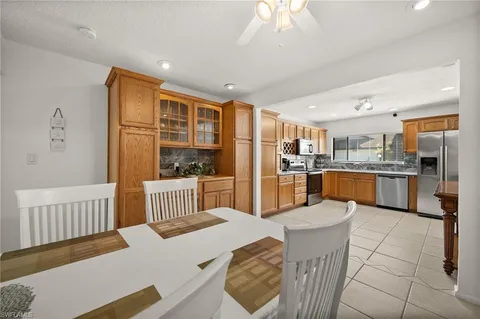 a kitchen with stainless steel appliances granite countertop a sink and cabinets