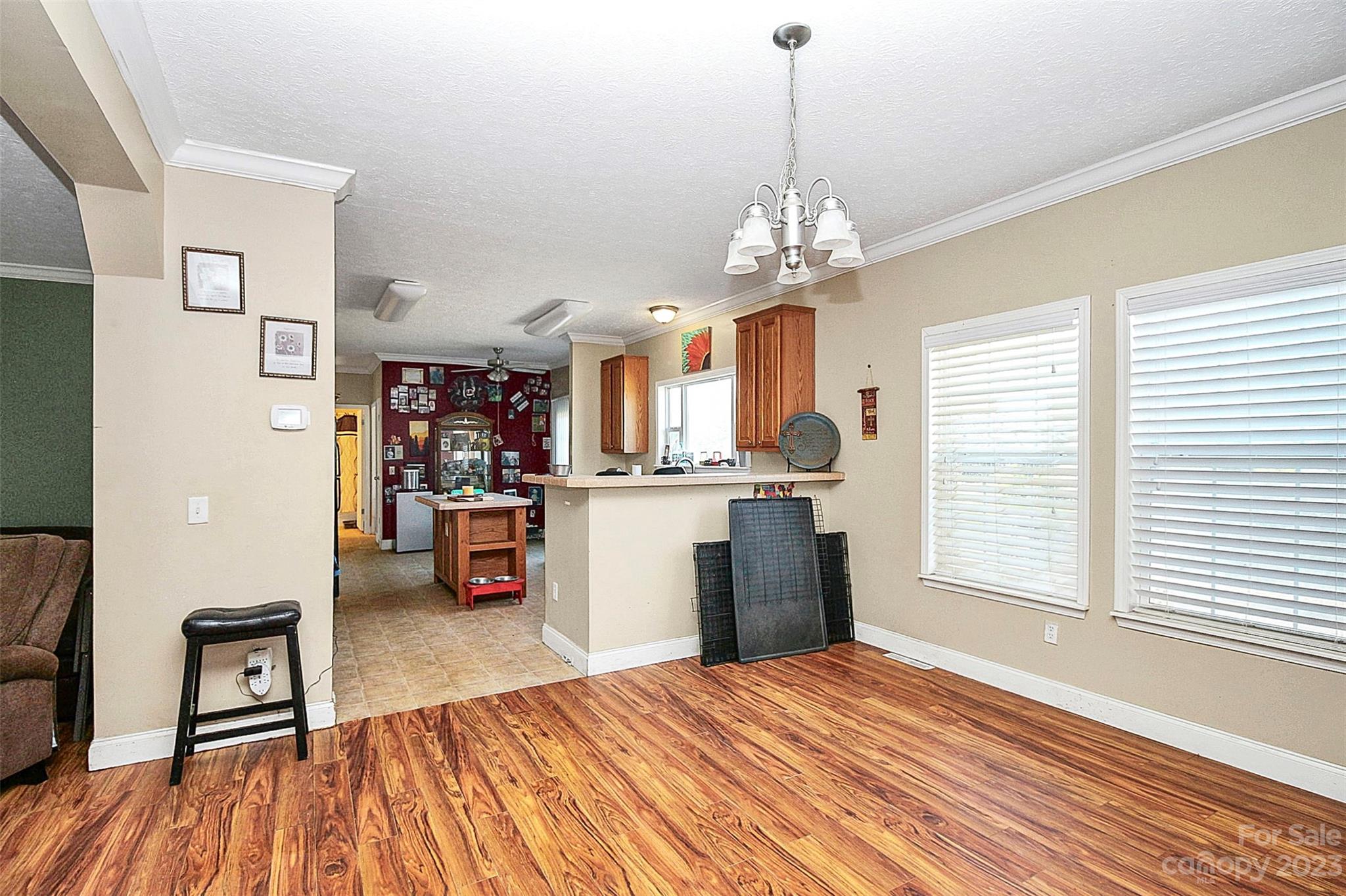 2075 Old Sullivan Road Lancaster, SC 29720 - Photo 8 of 31 a view of a kitchen with furniture and wooden floor