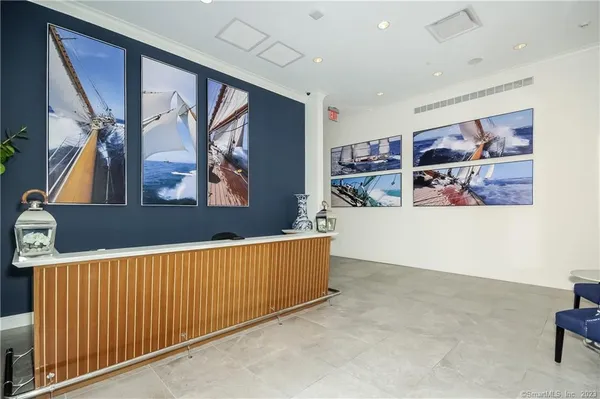 a view of a hallway with paintings on the wall