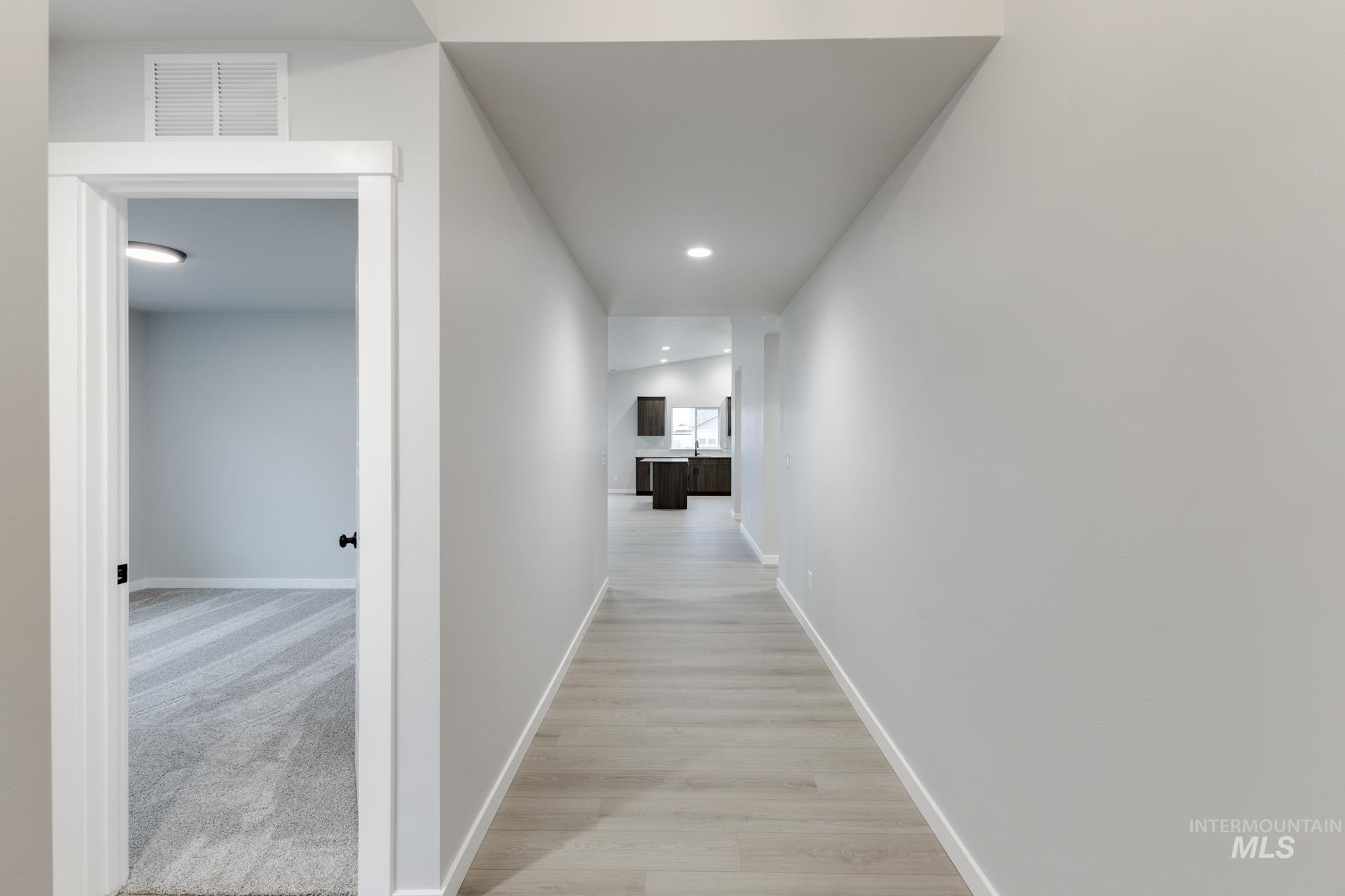 869 North Aleppo Way Meridian, ID 83642 - Photo 10 of 22 Hallway with recessed lighting and light wood-style floors