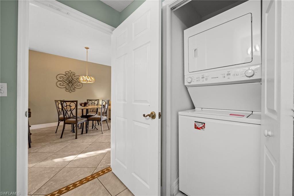 9175 Celeste Drive, Unit 306 Naples, FL 34113 - Photo 16 of 24 a view of washer and dryer