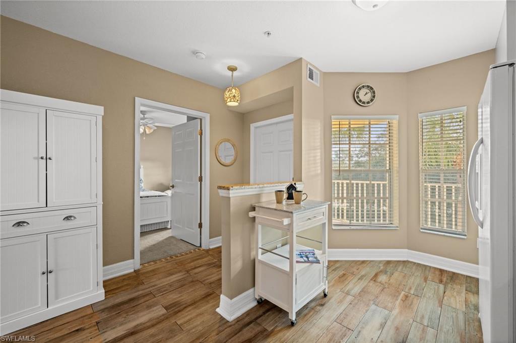 9175 Celeste Drive, Unit 306 Naples, FL 34113 - Photo 6 of 24 a living room with furniture and a window