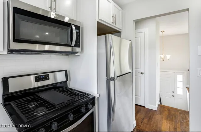 a kitchen with a stove and a microwave