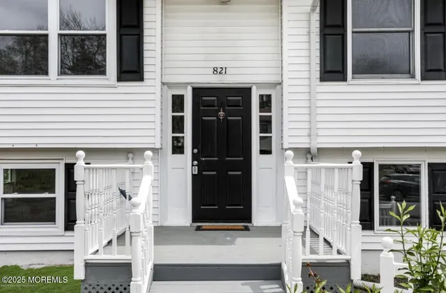 a front view of a house with a large windows