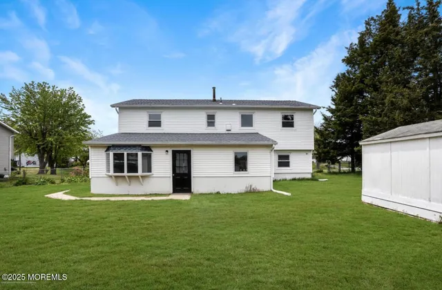 a view of a backyard with a house