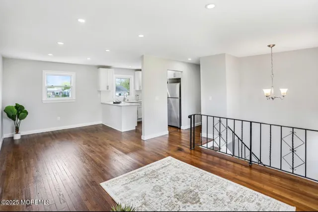 a view of a living room and wooden floor