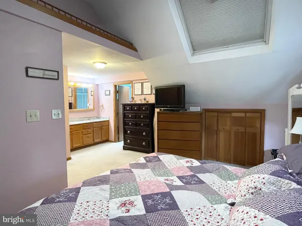 a bedroom with a bed and furniture