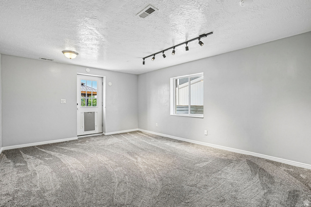 203 North 1900th Street West Mapleton, UT 84664 - Photo 27 of 48 Spacious room featuring gray textured carpeting and light gray wall paint