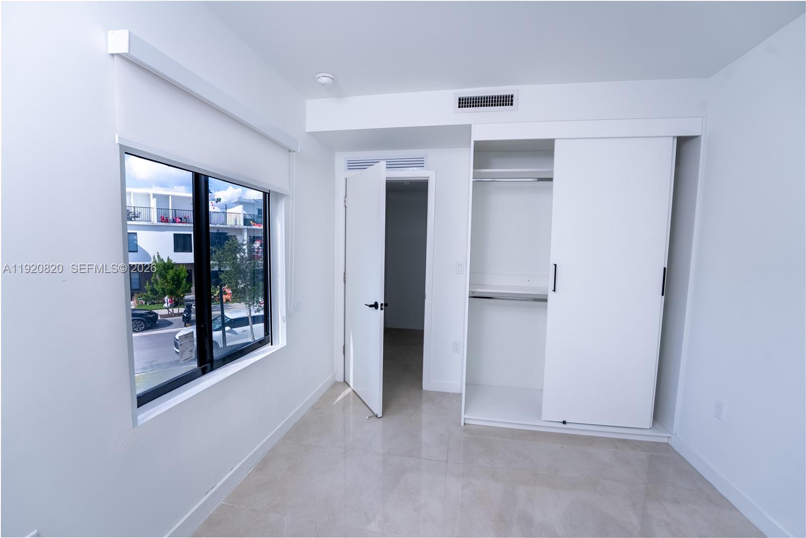 14580 Southwest 261st Street Homestead, FL 33032 - Photo 15 of 23 an empty room with windows