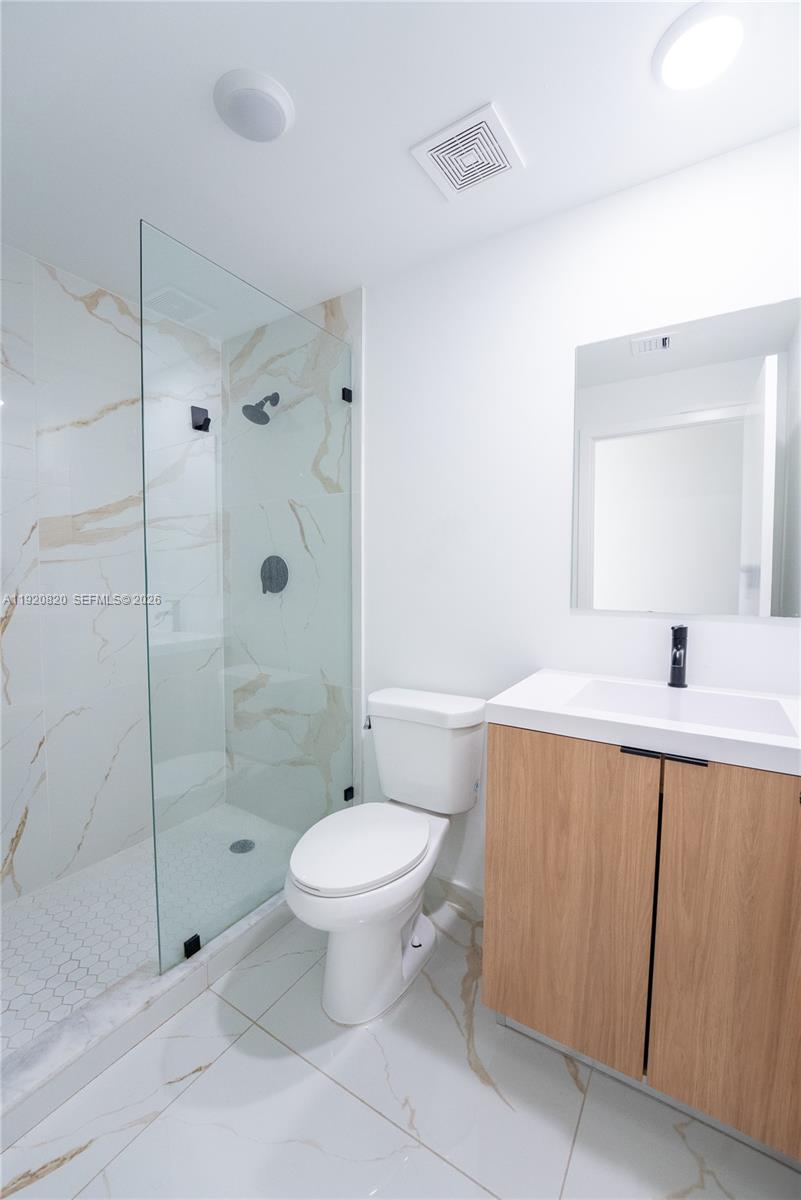14580 Southwest 261st Street Homestead, FL 33032 - Photo 16 of 23 a bathroom with a sink toilet and shower