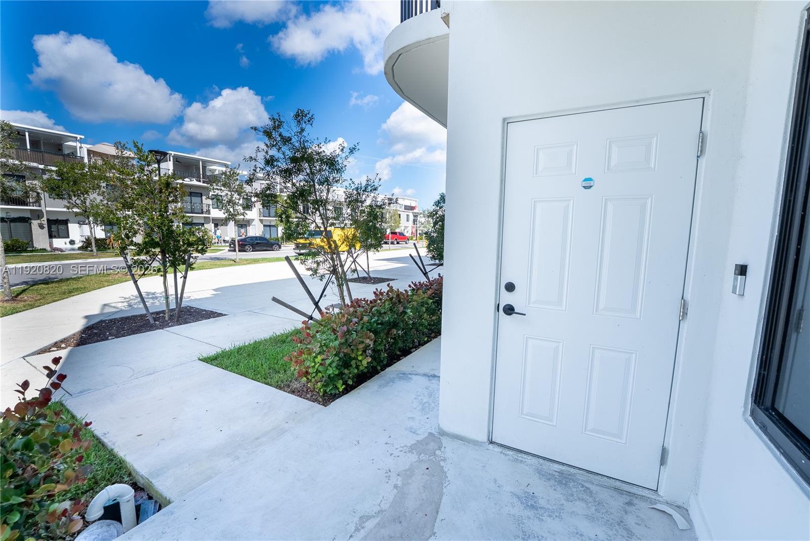 14580 Southwest 261st Street Homestead, FL 33032 - Photo 2 of 23 a view of a yard and front door