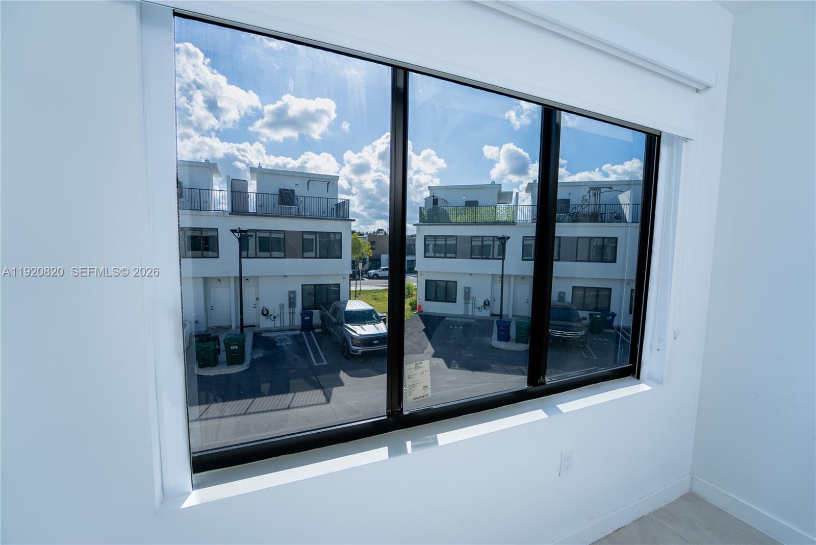 14580 Southwest 261st Street Homestead, FL 33032 - Photo 22 of 23 a window that has a glass door