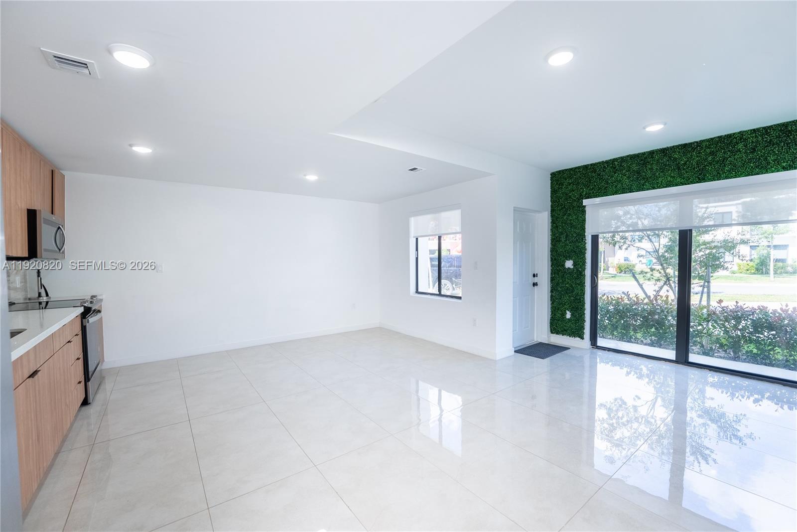 14580 Southwest 261st Street Homestead, FL 33032 - Photo 6 of 23 a view of a kitchen with a sink and a window