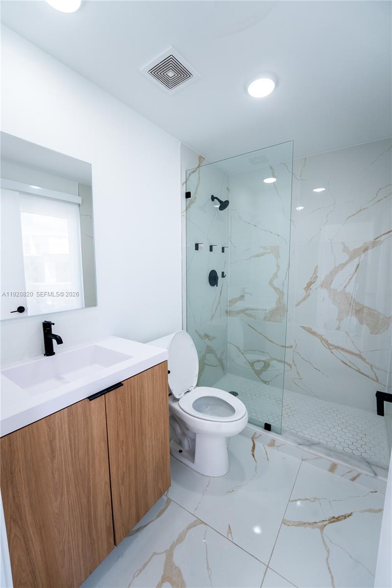 14580 Southwest 261st Street Homestead, FL 33032 - Photo 10 of 23 a bathroom with a sink toilet and shower