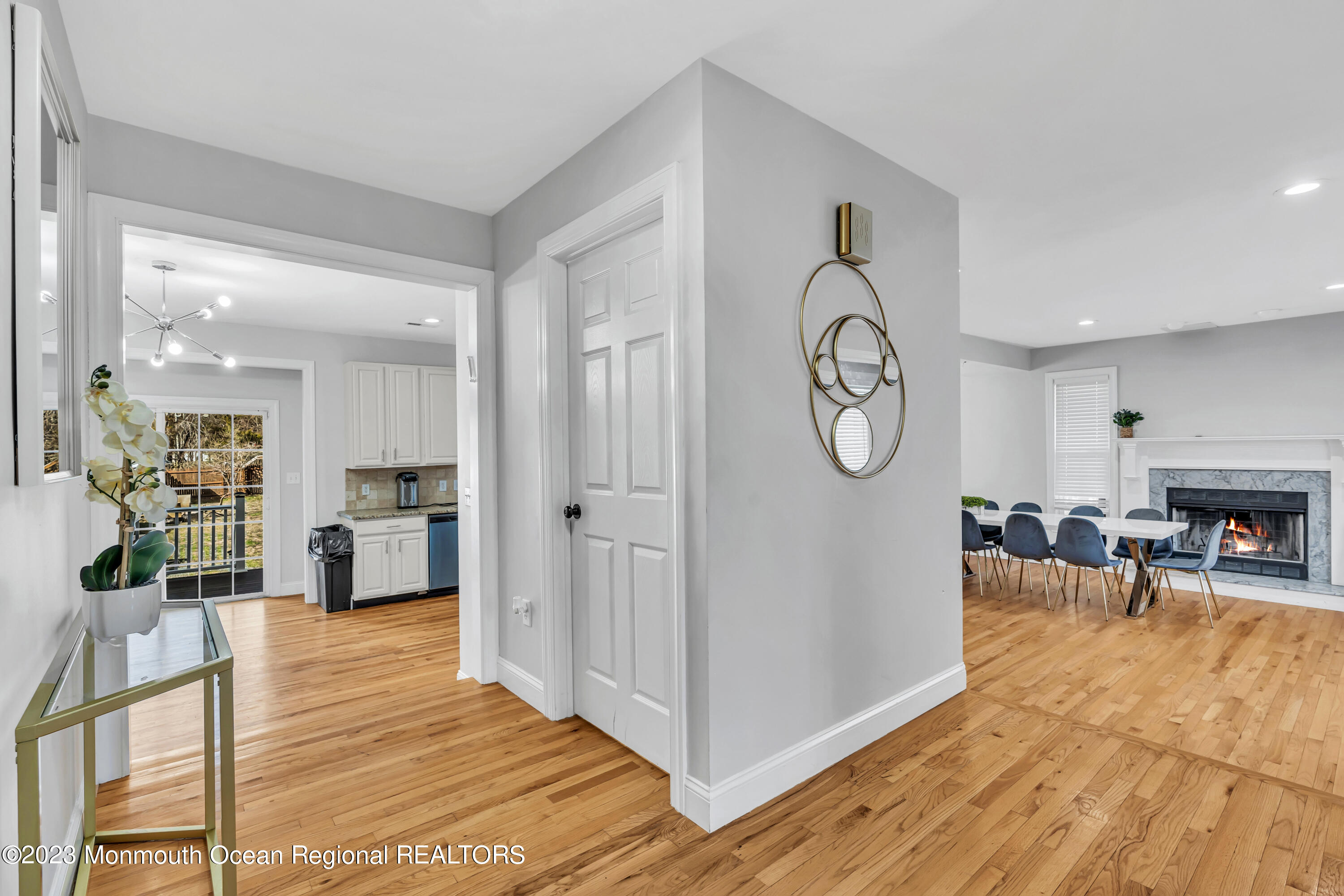 12 Clayton Road Howell, NJ 07731 - Photo 14 of 84 a view of a livingroom kitchen and dining room with wooden floor
