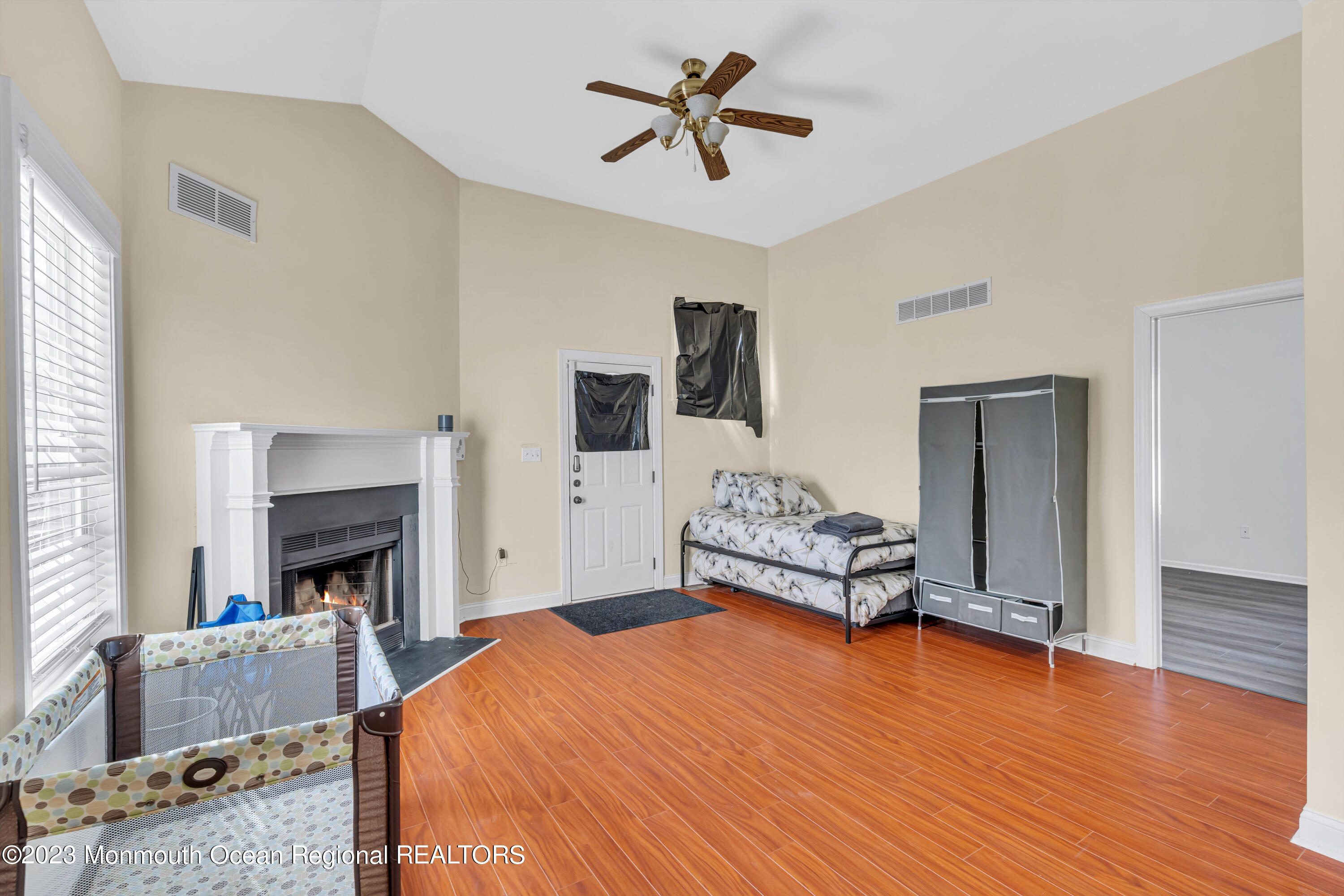 12 Clayton Road Howell, NJ 07731 - Photo 34 of 84 a bedroom with a bed and a fireplace