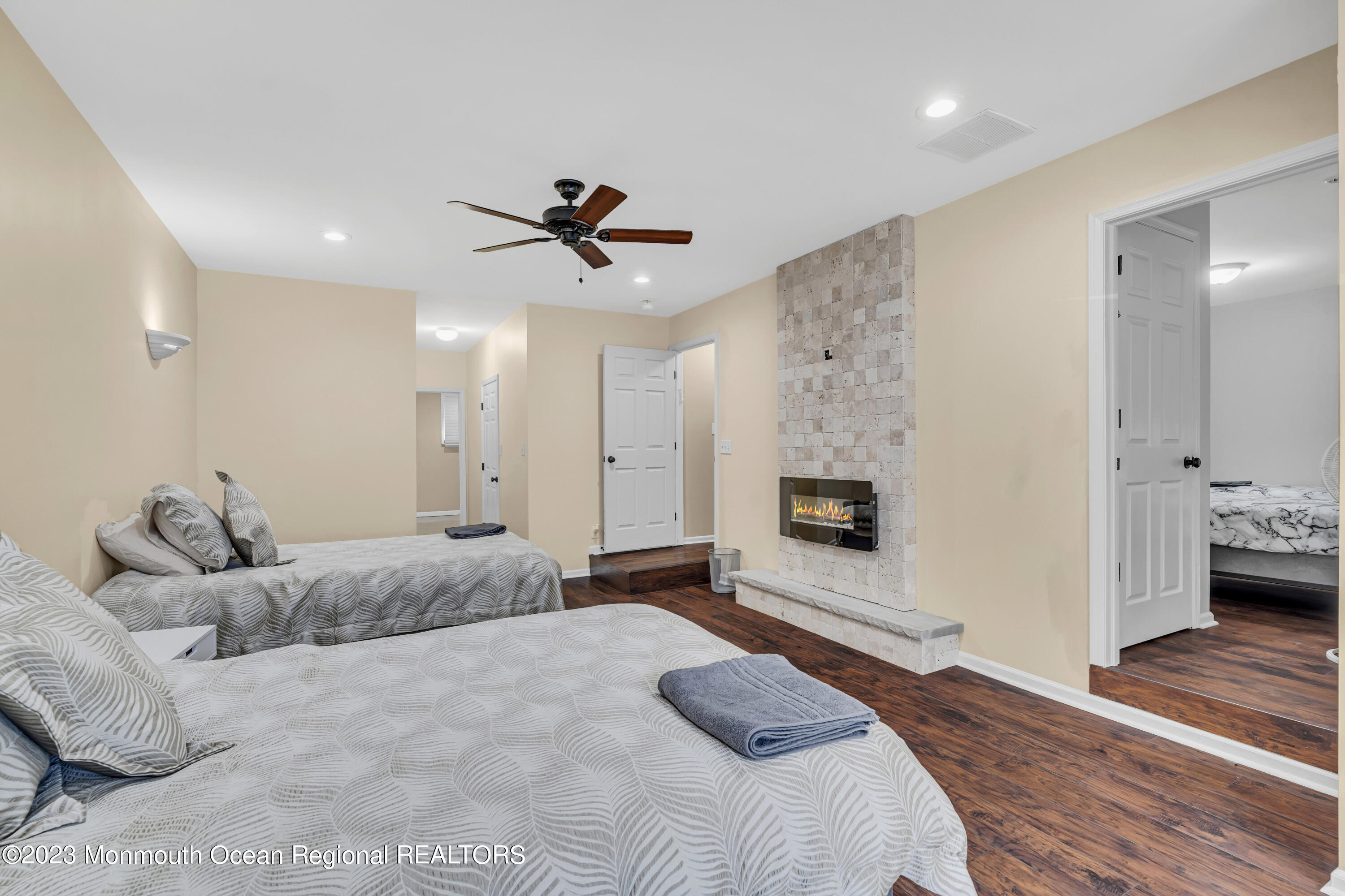 12 Clayton Road Howell, NJ 07731 - Photo 50 of 84 a bedroom with a bed and a fireplace