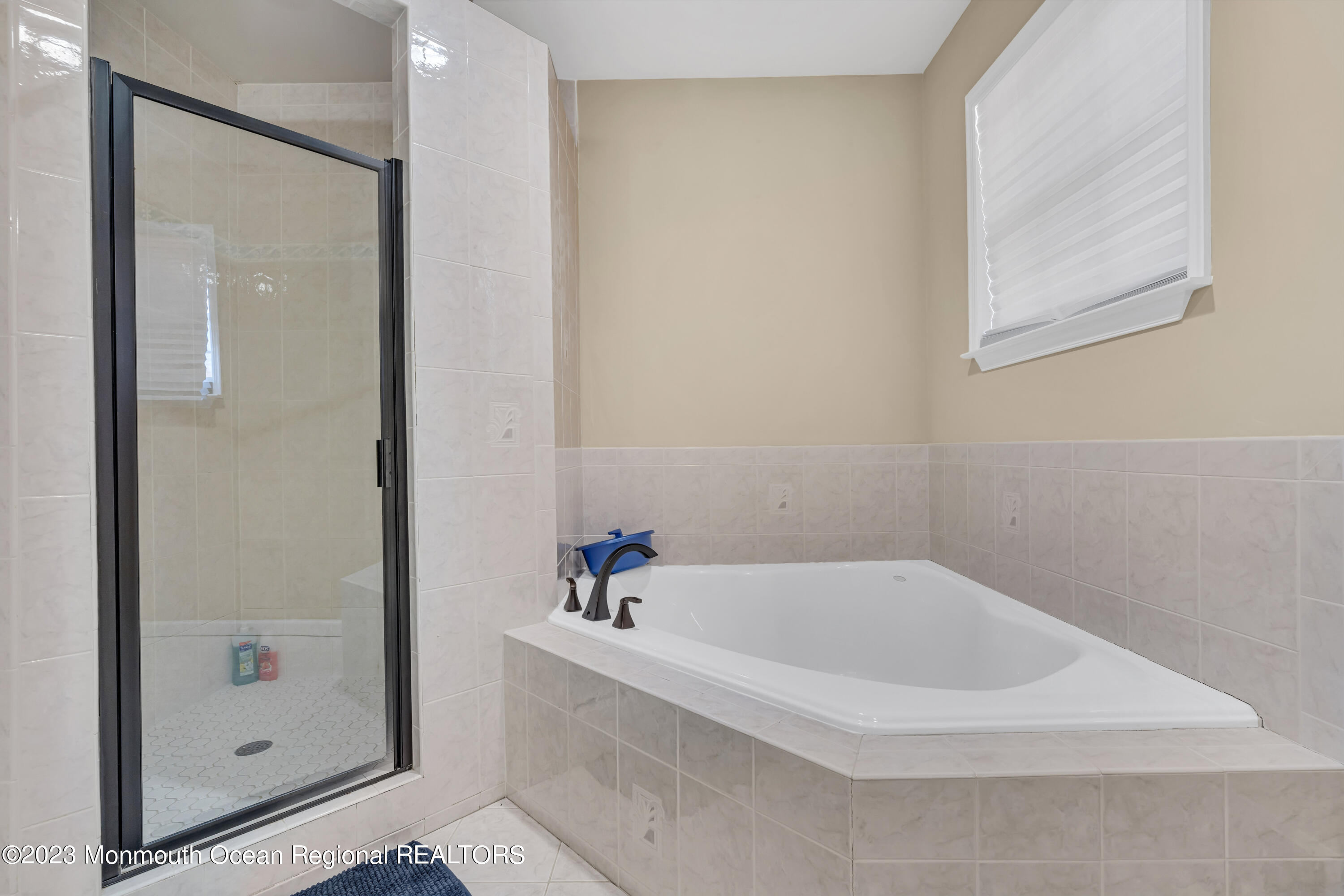 12 Clayton Road Howell, NJ 07731 - Photo 58 of 84 a white bath tub sitting next to a shower