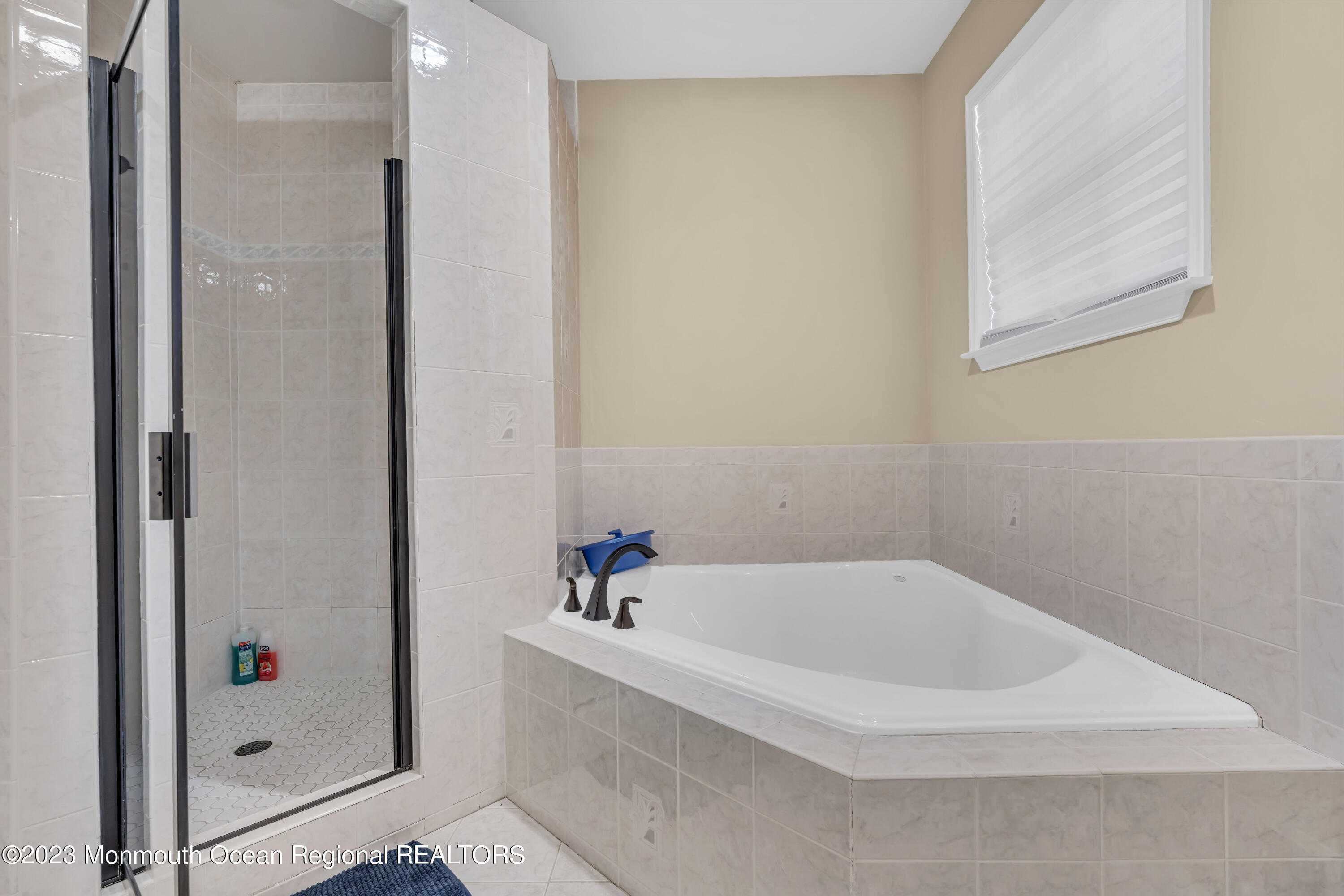 12 Clayton Road Howell, NJ 07731 - Photo 59 of 84 a white bath tub sitting next to a shower
