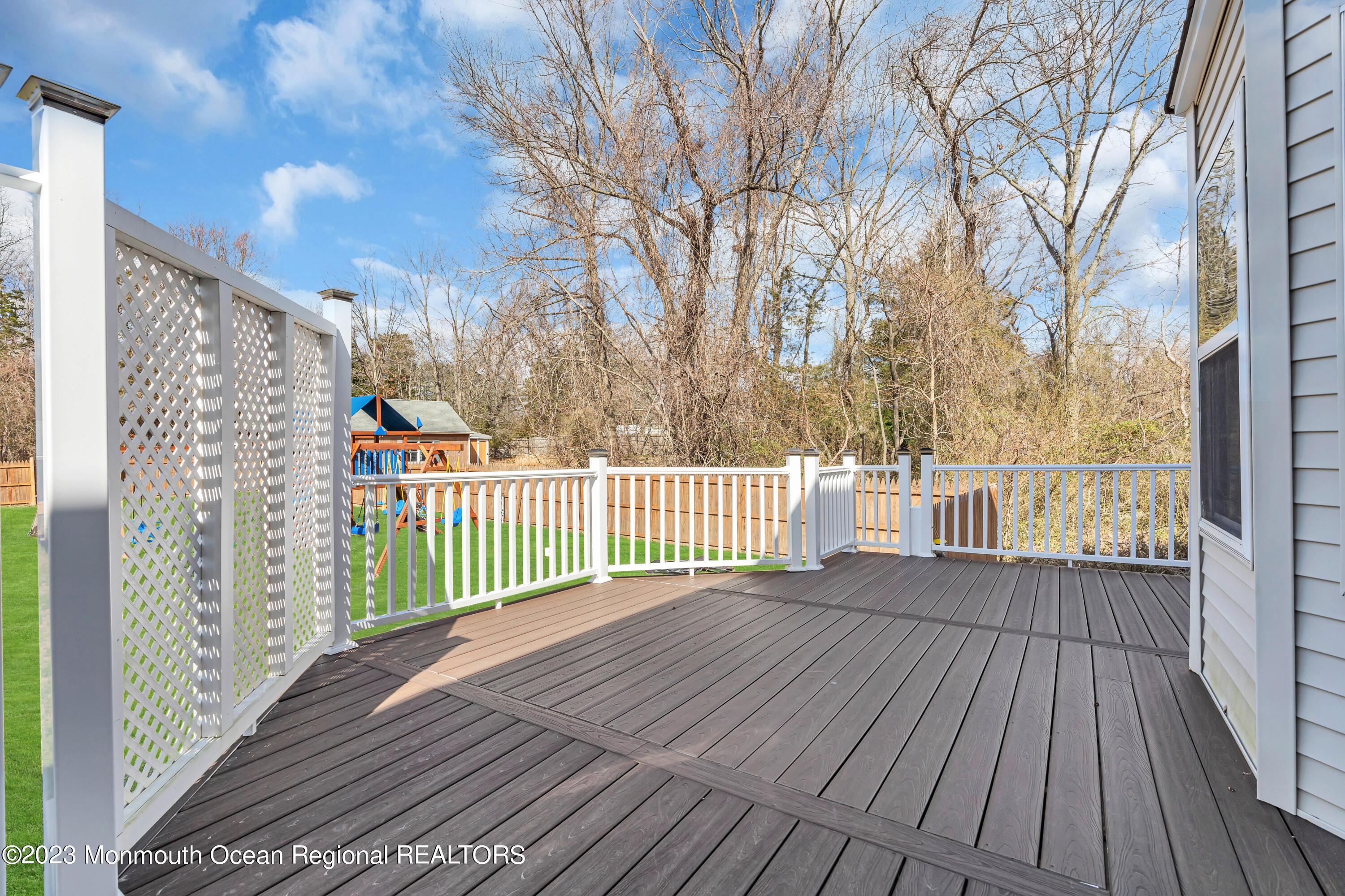 12 Clayton Road Howell, NJ 07731 - Photo 71 of 84 a view of a wooden deck with a yard