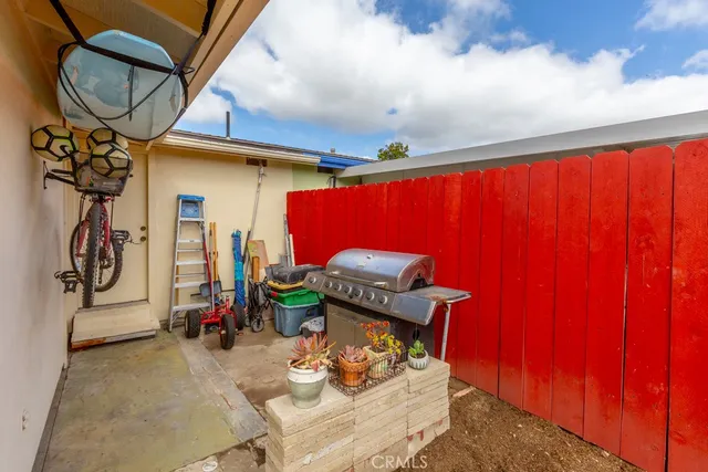 a view of backyard with patio and outdoor seating