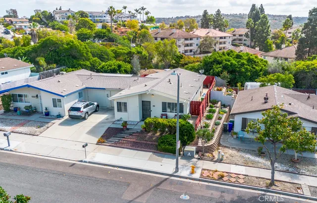 an aerial view of residential houses with outdoor space