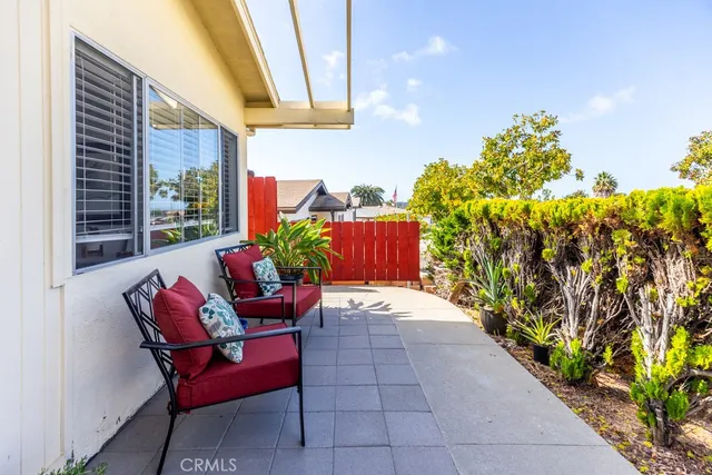 a view of a chairs and table in the patio