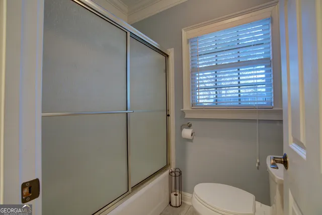 a view of a livingroom with furniture and a chandelier