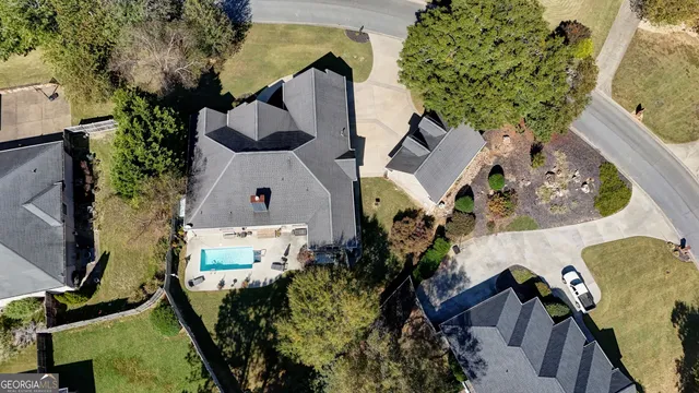 a view of a hallway with furniture and window