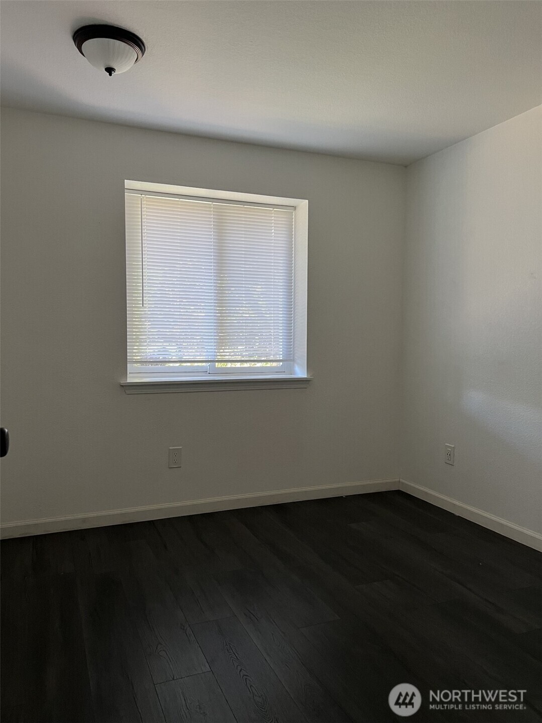 1124 Pinedrop Loop Southeast Olympia, WA 98513 - Photo 15 of 20 an empty room with wooden floor and windows