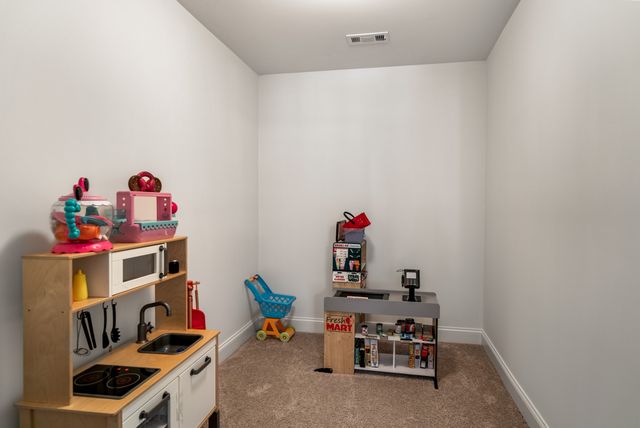 a room with furniture and toys