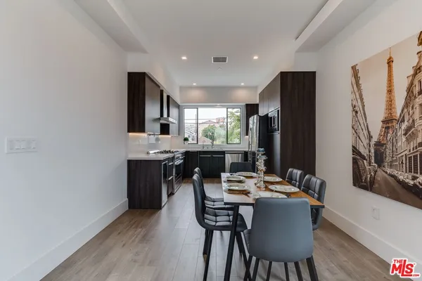 a kitchen with a stove and a sink
