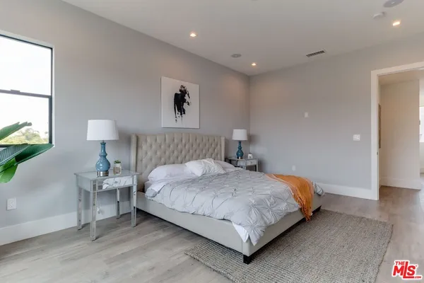 a bathroom with a tub shower and sink