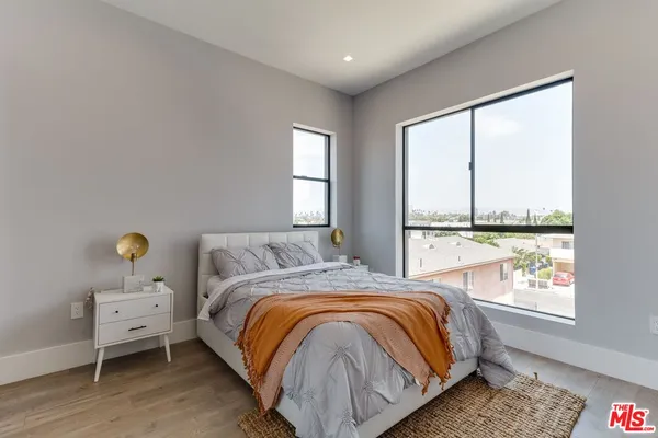 a bedroom with a bed and a walk in closet
